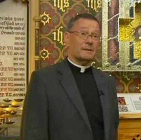 priest worshiping holy head