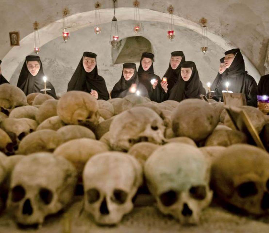 enthusiactic praying to skulls